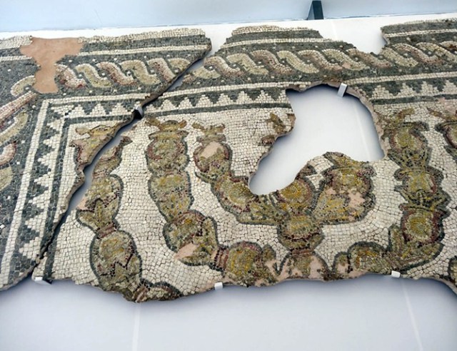 Ancient mosaic with a Menorah in the middle